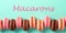 Letters macarons and row of macarons on turquoise