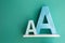 Letters A small and big size turquoise color on a