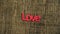 Letters word `LOVE` on wooden table