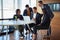 Letting his team take a look. a group of corporate businesspeople working in the boardroom.