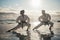 Letting their movements flow. Full length shot of two young martial artists practicing karate on the beach.