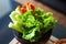 Lettuce ,cucumber and carots sliced in wooden bowl in natural diet concept