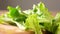 Lettuce salad falls on table macro shot, drops of water Close up