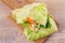 Lettuce wraps with chicken, carrot, peanuts and ginger-scallion oil
