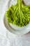 Lettuces leaves on white plate on white background