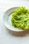 Lettuces leaves on white plate on white background