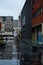Leuven, Flemish Brabant Region, Belgium - The wet Martelaren square with traffic and co working spaces