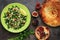 Levantine vegetarian salad with bulgur, parsley, tomato. Middle eastern and arabic salad tabbouleh , pita bread, pomegranate, figs