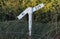 A level or gradient sign by the side of the railway track of the West Somerset heritage railway