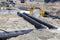 Leveling insulated pipes for underground district heating
