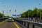 Leverkusen, Germany - July 26, 2019: Road traffic on the German Highway autobahn A1 with road signs and traffic light. Cars ride