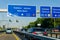 Leverkusen, Germany - July 26, 2019: Road traffic on the German Highway autobahn A1 with road signs and traffic light. Cars ride