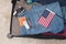 Levi\\\'s jeans, an American passport and dollars and other things are packed into a suitcase. Travel concept