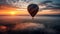 Levitating hot air balloon soars high over mountain range