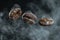 Levitating roasted coffee beans on dark background with copy space for text placement