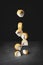 Levitating sushi and rolls over black background. Creative art concept for web banner or advertisement