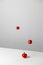 Levitation of fresh cut tomato. Stylish creative art composition. Vertical orientation