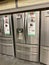 A LG, Samsung, and Whirlpool stainless steel french door refrigerators on sale at a Home Depot Store