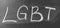 LGBT, abbreviation for LGBT. A symbol of free love. Hand written letters in white chalk on a school blackboard. Black and white