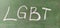 LGBT abbreviation written in white chalk on a green school board. Diversity of sexuality and gender identity based on culture.