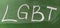 LGBT abbreviation written in white chalk on a green school board. Diversity of sexuality and gender identity based on culture.