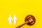 LGBT divorce. Judge gavel, male couple on yellow background top-down copy space