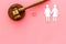 LGBT divorce. Judge gavel, rings, female couple on pink background top-down copy space