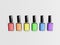 LGBT flag colors nail polish bottles on white background