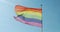 LGBT flag. Pride flag - Close up view. Blue sky on the background