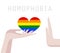 LGBT giving heart, love to Anti-homosexual people. Rainbow heart in hand. LGBT, homosexual discrimination, homophobia concept.