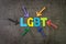 LGBT, initialism that stands for lesbian, gay, bisexual, and transgender concept, multi color arrows pointing to the word LGBT at