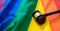 LGBT Law, Gay marriage. Judge gavel on rainbow color textile, close up. Transgender rights