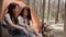 Lgbt lesbian women couple camping or picnic together in forest, teenager enjoy moment talking in front of their tent. Adventure