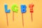 LGBT letters on candles