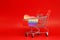 LGBT , LGBTQI Heart paper Pride flag color with Shopping cart on red background - Love Pattern Sexual diversity - Lesbian gay bise