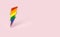 LGBT lightning bolt rainbow pin pride symbol isolated on pastel pink background with copy space on the right side. Sexual minority