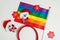 LGBT and New Years concept. Rainbow flag and New Year`s decor on a white background