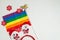 LGBT and New Years concept. Rainbow flag and New Year`s decor on a white background. Place for your text