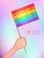 LGBT poster design. Human fist raised up with rainbow flag. Gay Pride. LGBTQ concept. Isolated vector colorful
