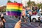 LGBT pride month background. a spectator waves a gay rainbow flag at LGBT gay pride parade festival in Thailand.