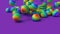 LGBT Rainbow rubber balls falling on a lilac surface minimalistic cover footage