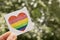 LGBT symbol. Hand holding watercolor rainbow heart.
