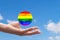 Lgbt union, pride concept in world, global solidarity with sexual minorities,hand with planet in lgbtq flag colors,Element of the