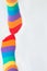 LGBTI+ community rights. Visibility and rights. Top view of two left feet wearing rainbow socks. White background