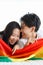 LGBTQ couple lovers, a handsome girl as a man or butch femme girl laying on a bed with the rainbow flag the symbol of LGBT,