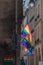 LGBTQ flags on corner of old building in Paris during pride. Transgender Pride flag