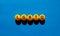 LGBTQ symbol. Concept word acronym `LGBTQ` on orange table tennis balls. Beautiful blue table, blue background. LGBTQ concept,