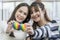 Lgbtqia Concept. Two young women holding a rainbow heart symbolizing the LGBT community