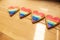 LGTB hearts cookies on a wooden table. Rainbow heart cookie. Heart lgbt+ sign rainbow color stripe. Symbolic free love concept