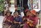 Lhasa, Tibet, China, Chengguan District, June 22 2019: Monastery Sera three women in traditional clothes chat on a bench